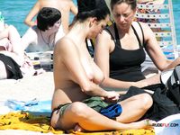 Woman in Bikini Bottoms on Beach
