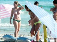 Pierced MILF is not afraid to display her curvy body that includes round tits and fat ass as she enters the water before being joined by her lover 2