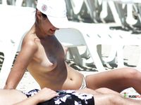 She gets caught on camera by voyeur with her perky tits and trimmed pussy showing 3