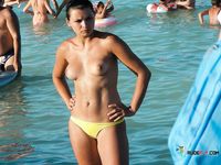 Skinny brunette with a fit body plays tennis with her perky tits out while other girls sunbathe topless 4