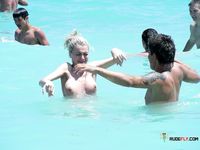 She goes around topless, showing off her beautiful, large, natural tits 3