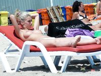 She goes around topless, showing off her beautiful, large, natural tits 3