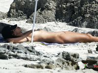 Playful nudist chicks have fun at the beach during a hot summer day 2