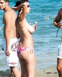 Naked beach sounds like a perfect place to be for these two hot, slim chicks as they topless enjoy the sun and lure the views of the passing bys 2