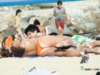 Naked beach sounds like a perfect place to be for these two hot, slim chicks as they topless enjoy the sun and lure the views of the passing bys 2