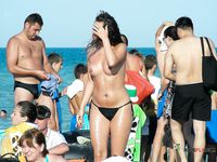 Chubby nudist mom is walking around the nudist camp while displaying her perfect tits and shave pussy while her family is having fun in the sea 2