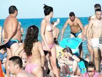 Chubby nudist mom is walking around the nudist camp while displaying her perfect tits and shave pussy while her family is having fun in the sea 2