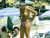 Dashing hotties lie down or sit around sunbathing, with their supple breasts and smoothly shaved pussies on display 4