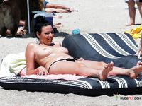 Nudist babe with plump boobs looks around while being recorded, and she's clueless about it 2