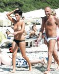 Topless Stroll Across the Sand in a Naturist-Friendly Beach