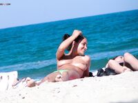 The feeling of complete freedom during a topless afternoon by the waves.