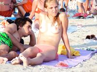 Sunscreen and a Sandwich on a Sunny Topless Beach