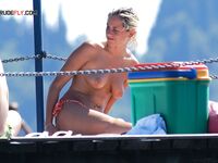 . Artful photography of a lady enjoying the liberation of a clothes-free vacation.