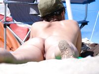 Posing with elegance in a clothing-optional environment.