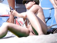 Posing with elegance in a clothing-optional environment.