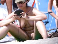 Posing with elegance in a clothing-optional environment.