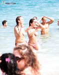 The beauty of bare skin and the vast ocean at a naturist-friendly shore.