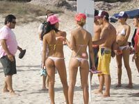She Walks Through Shallow Water in Pink Bikini Bottoms