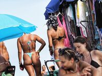 She Walks Through Shallow Water in Pink Bikini Bottoms