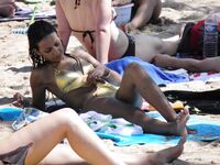 She Walks Through Shallow Water in Pink Bikini Bottoms