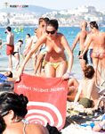 A lady finding her own rhythm with the tide at a clothing-optional beach.