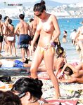 A lady finding her own rhythm with the tide at a clothing-optional beach.
