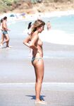 The perfect tan: capturing a woman enjoying the sun without any restrictions.