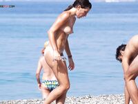 Pebbles Beneath Her Feet on an Open Nude Beach Walk