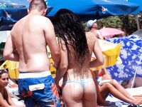 The natural light of the coast enhancing the beauty of a topless model.