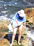 Embracing the cooling sea water on bare skin at a secluded, clothing-free shoreline. 2