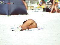 Atmospheric imagery of a woman finding her peace at a hidden, clothing-optional cove.