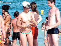 My wife getting her beautiful breasts and hard nipples tanned on the strand.