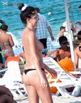 My wife getting her beautiful breasts and hard nipples tanned on the strand.