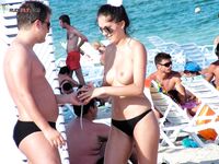 My wife getting her beautiful breasts and hard nipples tanned on the strand.