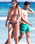 Ocean Waves Rolling Past a Topless Beach Walk