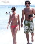 Ocean Waves Rolling Past a Topless Beach Walk