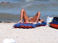 Sunbathing on a Red and Blue Air Mattress at a Nude Beach