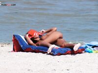 Sunbathing on a Red and Blue Air Mattress at a Nude Beach