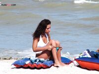 Sunbathing on a Red and Blue Air Mattress at a Nude Beach