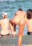 A collection of candid moments at a beach where being topless is the norm.