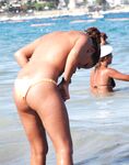 . Capturing the radiant glow of a sun-lover at a clothing-free beach.