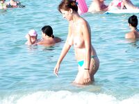 Capturing the authentic, natural beauty of a woman at a topless beach. 3
