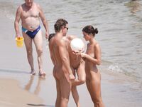Ready for Volleyball Near a White Ball on the Sand
