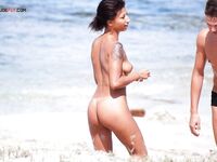 Sandy Shoreline Nude Beach Walk with Shoulder Tattoo