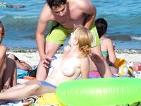 Sandy Shoreline Nude Beach Walk with Shoulder Tattoo