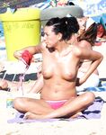 The joy of a topless swim in the clear, invigorating coastal waters. 2