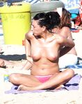 The joy of a topless swim in the clear, invigorating coastal waters. 2