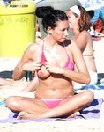 The joy of a topless swim in the clear, invigorating coastal waters. 2