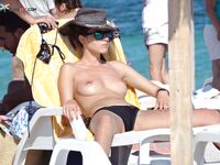 Capturing the aesthetic of a topless afternoon at a private coastal resort.