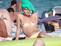 Capturing the aesthetic of a topless afternoon at a private coastal resort.